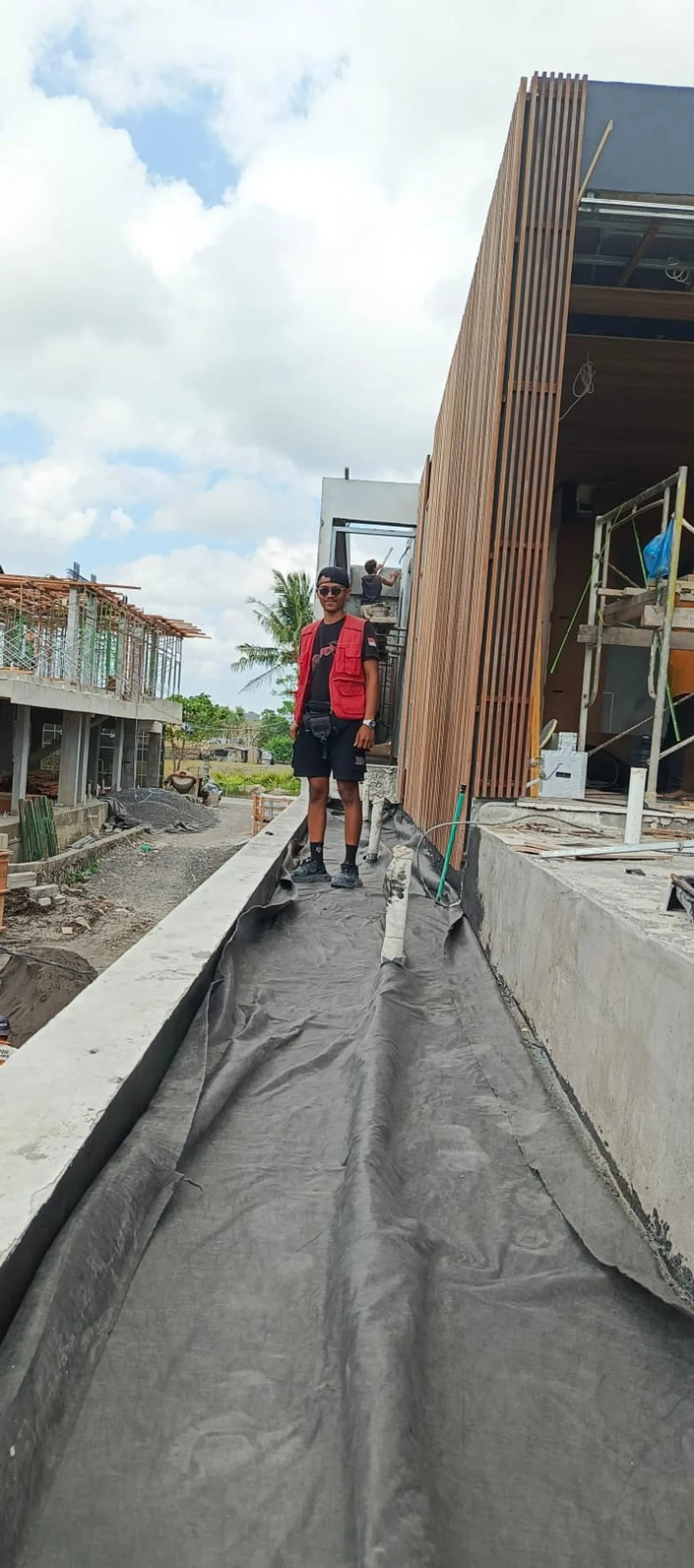 Kadek walking a waterproofing membrane run on an active site